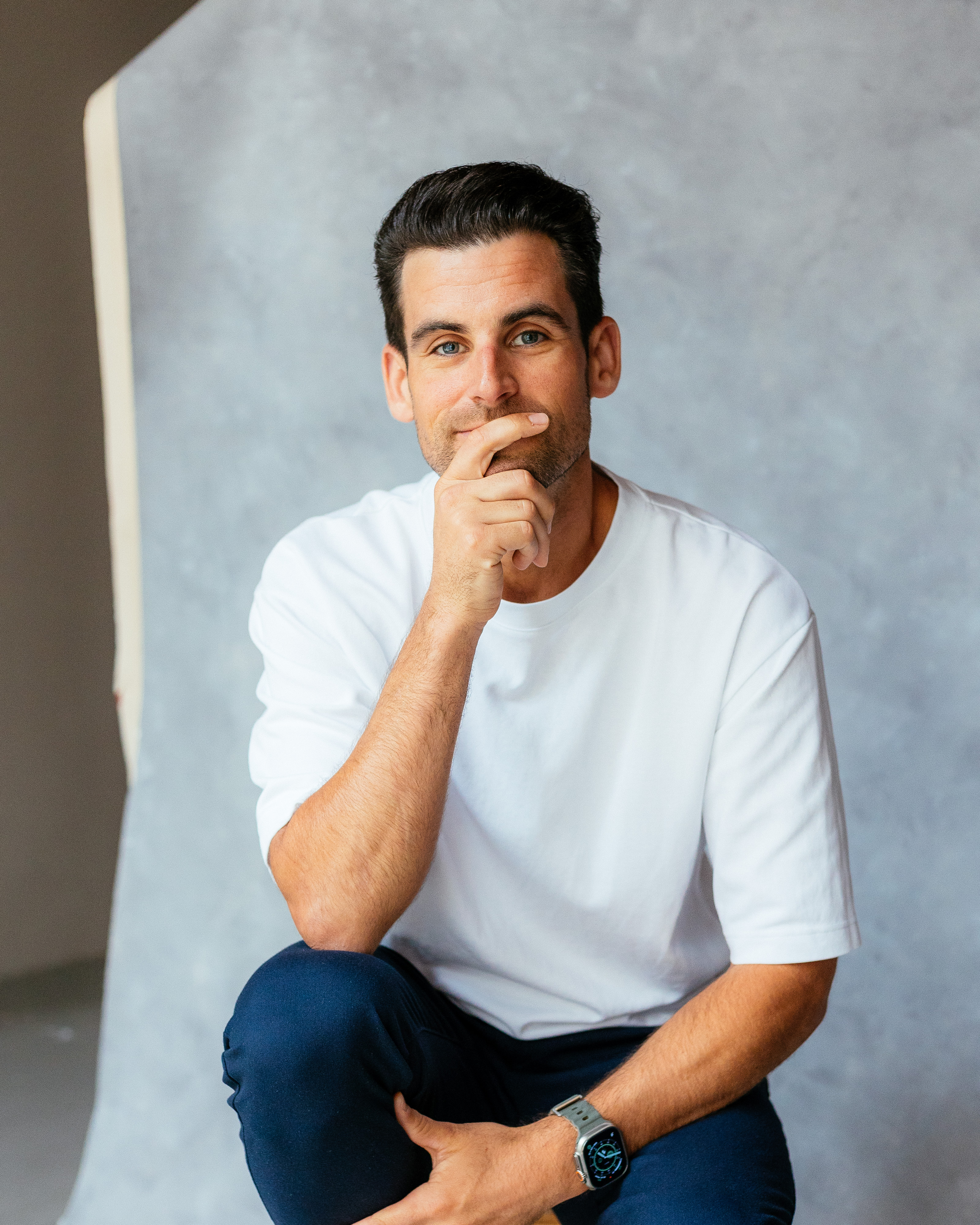 Portrait photograph of Jonathan Clifford, a documentary and portrait photographer based in London. Jonathan is shown in a candid pose that reflects his documentary photography style.